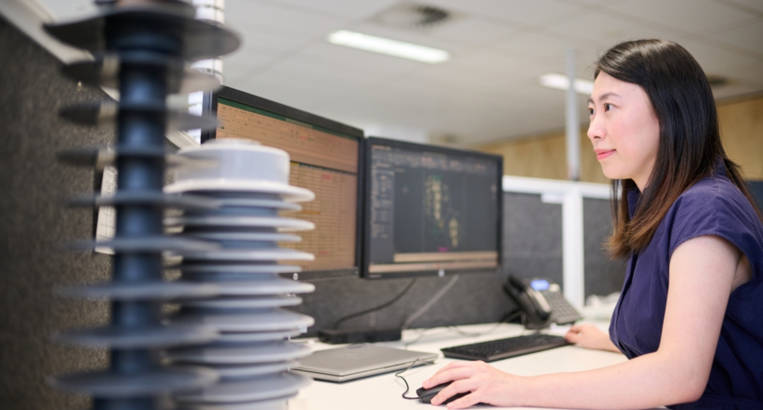 Women engineering working on a computer in a lab setting