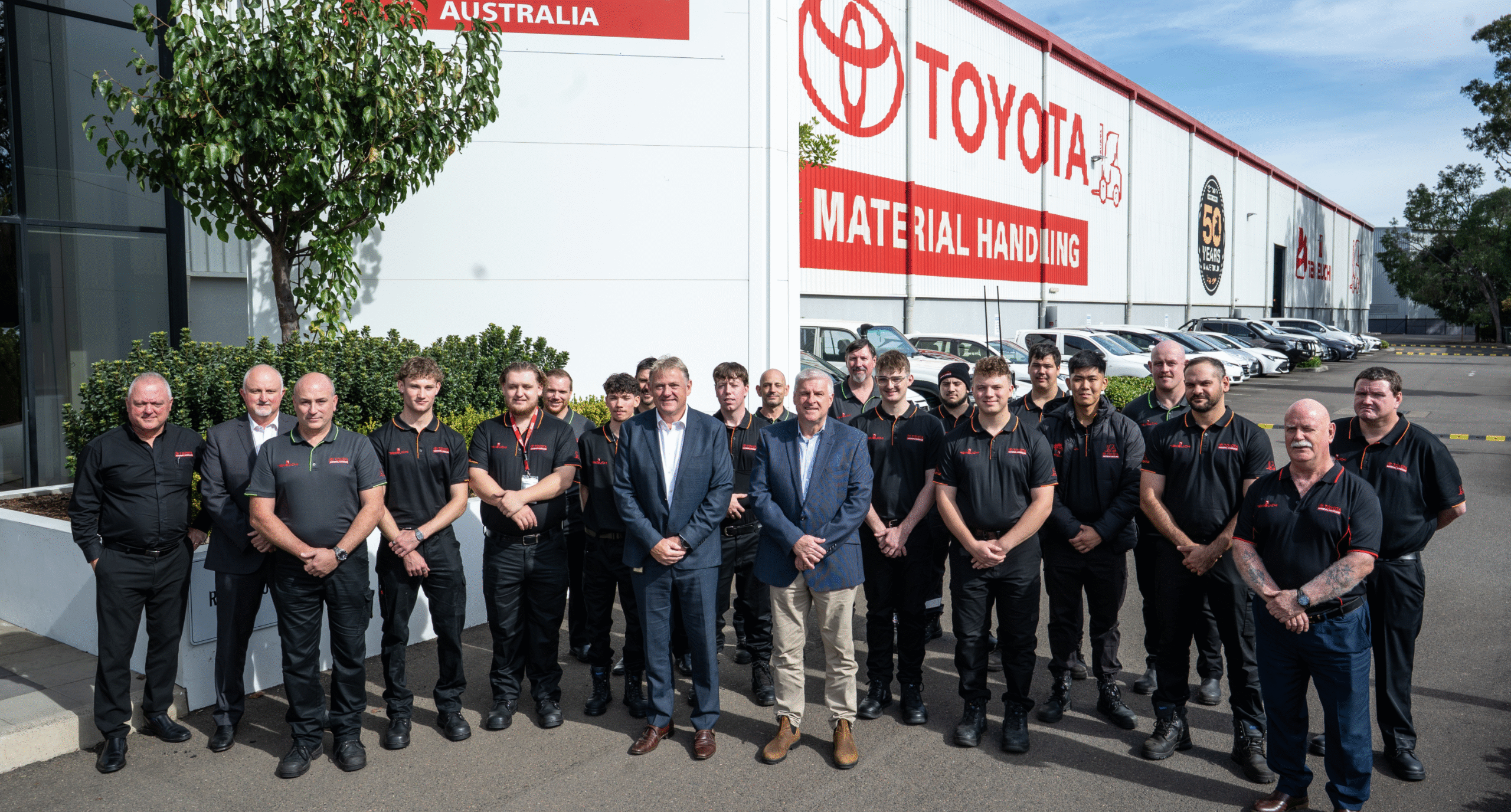 TMHA team photo stood outside toyota yard