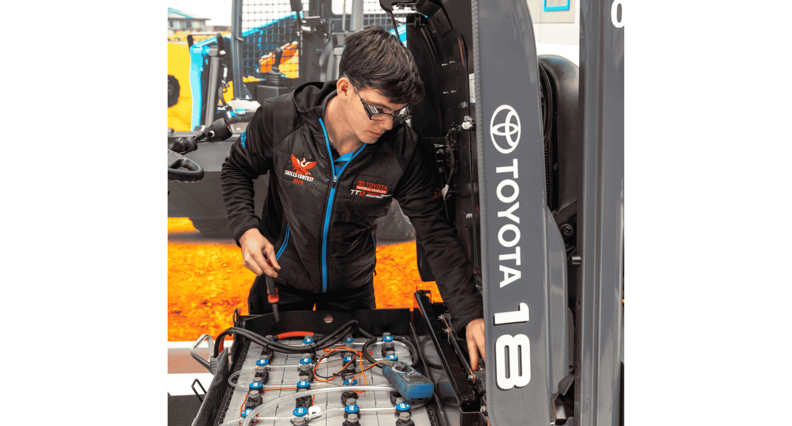 Work experience student looking at heavy vehicle equipment machinery
