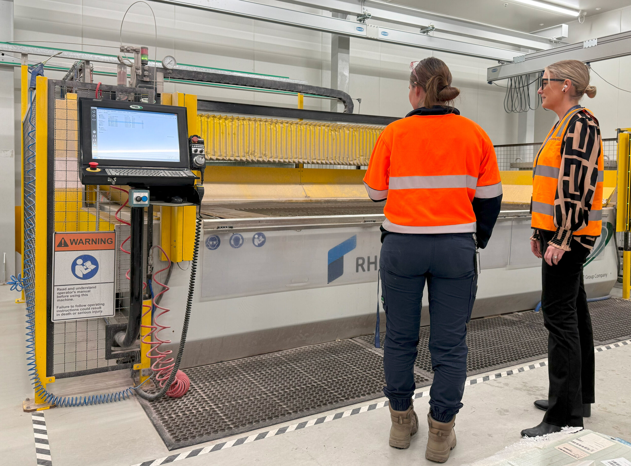 Two Defence Engineers wearing orange high vis