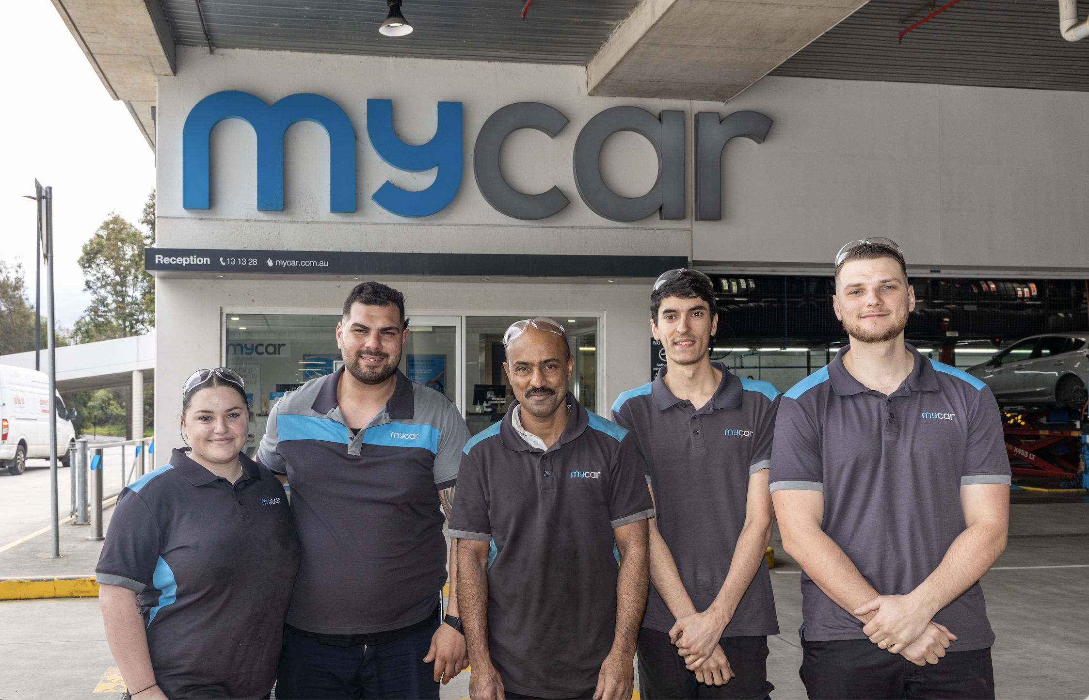four mycar apprentices stood smiling with senior leader
