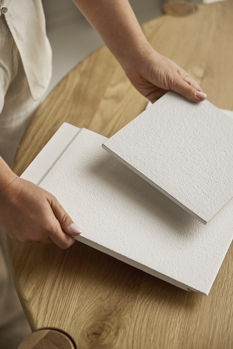 fine texture white cladding samples being compared at a table
